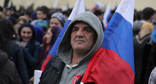 Участник митинга в Грозном, март 2015 года. Фото Ахмеда Альдебирова для "Кавказского узла" Участник митинга в Грозном, март 2015 года. Фото Ахмеда Альдебирова для "Кавказского узла"